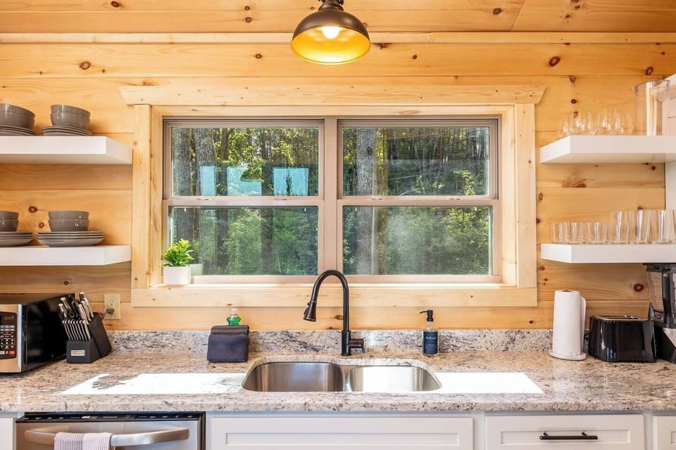 Main floor well-stocked kitchen; everything you need to cook meals when you want to stay in and enjoy the cabin.