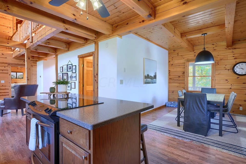 Kitchen opens up to living room and dining room table