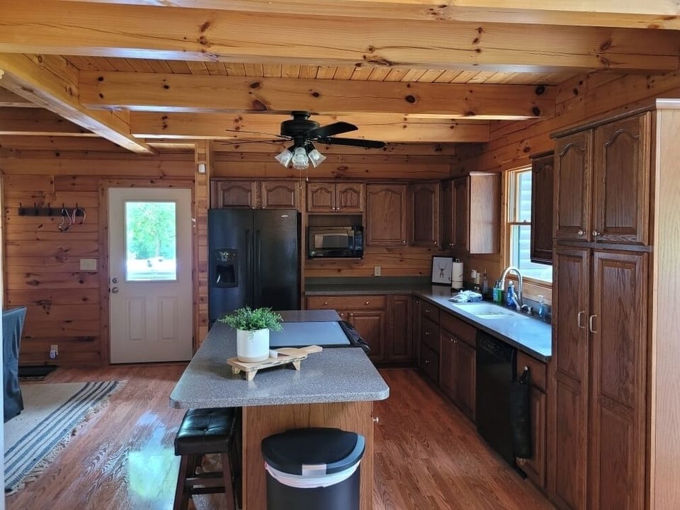 Large island with bar stools in kitchen
