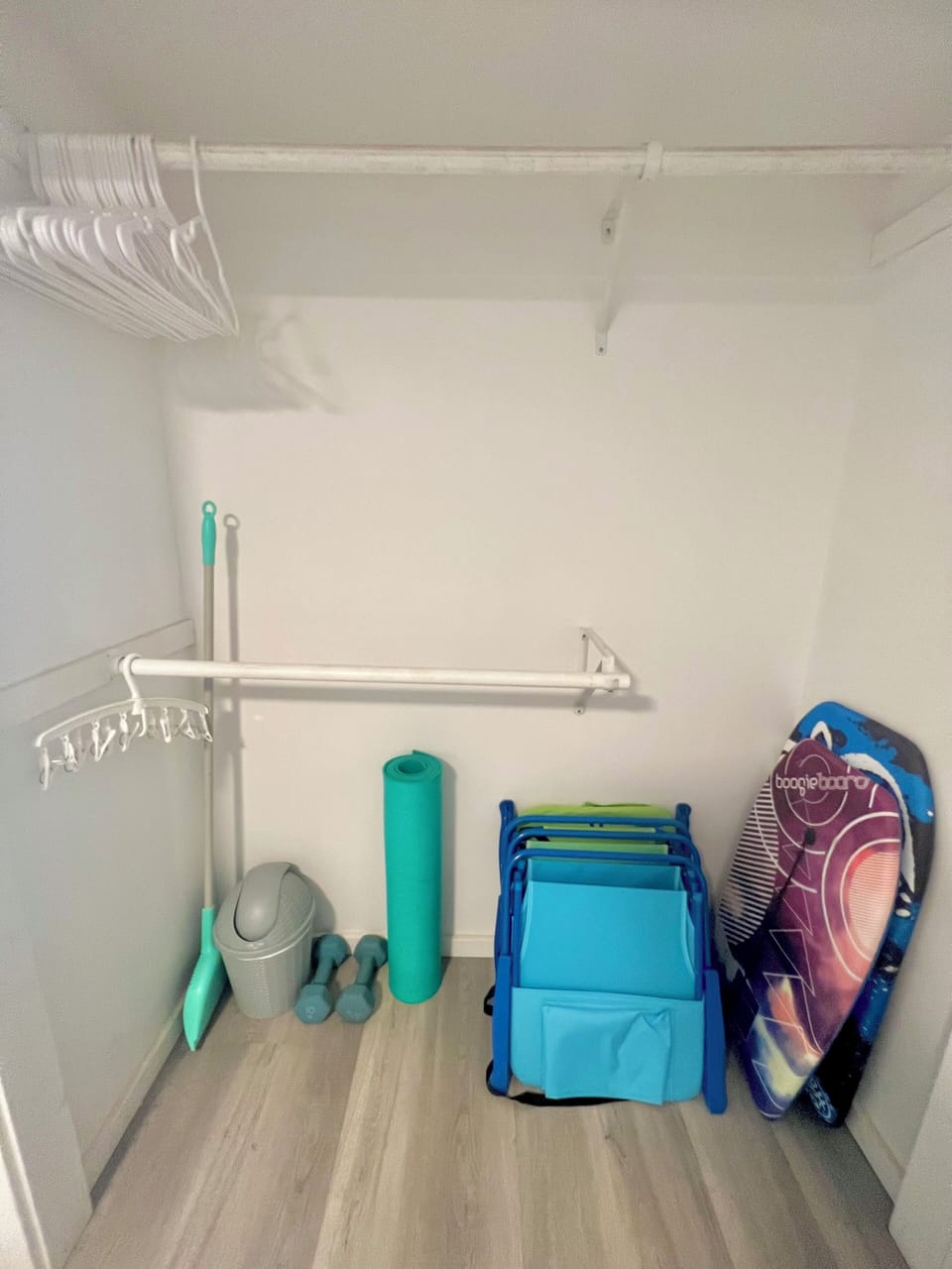 Beach chairs, boogie boards, yoga mat, weights, beach umbrella and a cooler