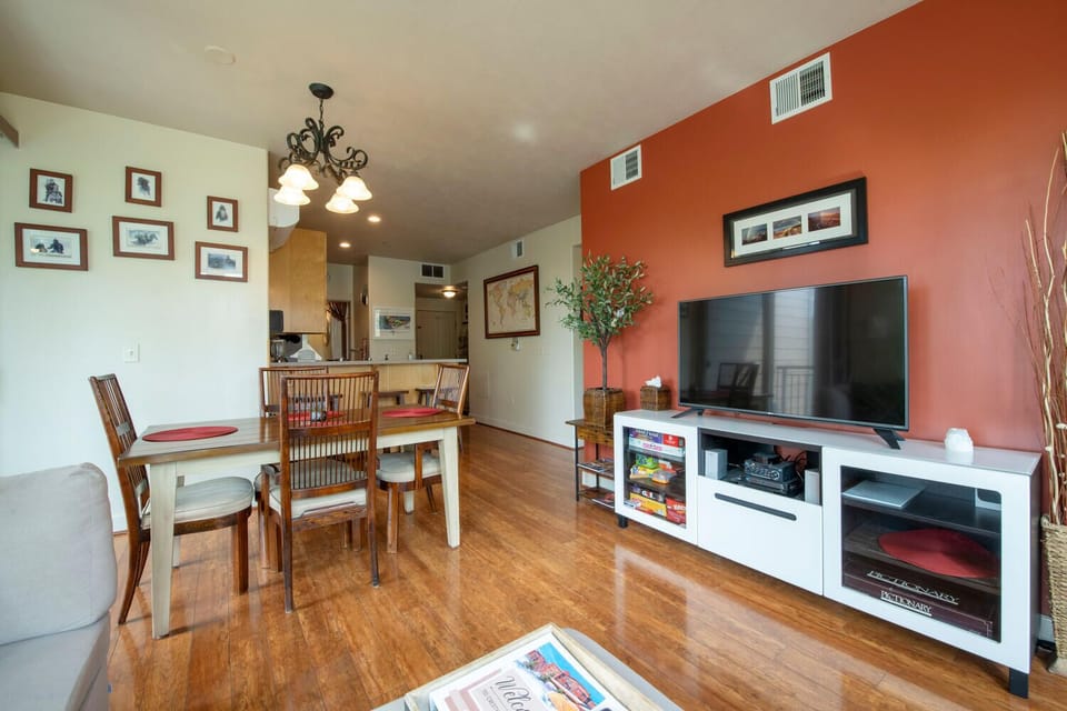 Living area with 55 in smart TV with cable, Netflix access & DVD player
