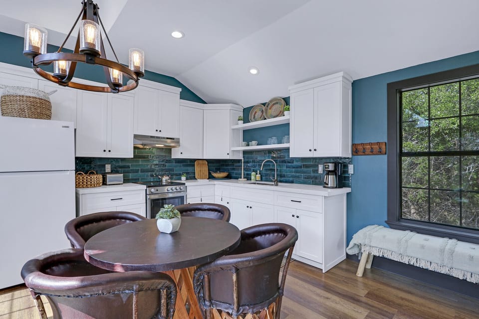 Dining table for four adjacent to kitchen