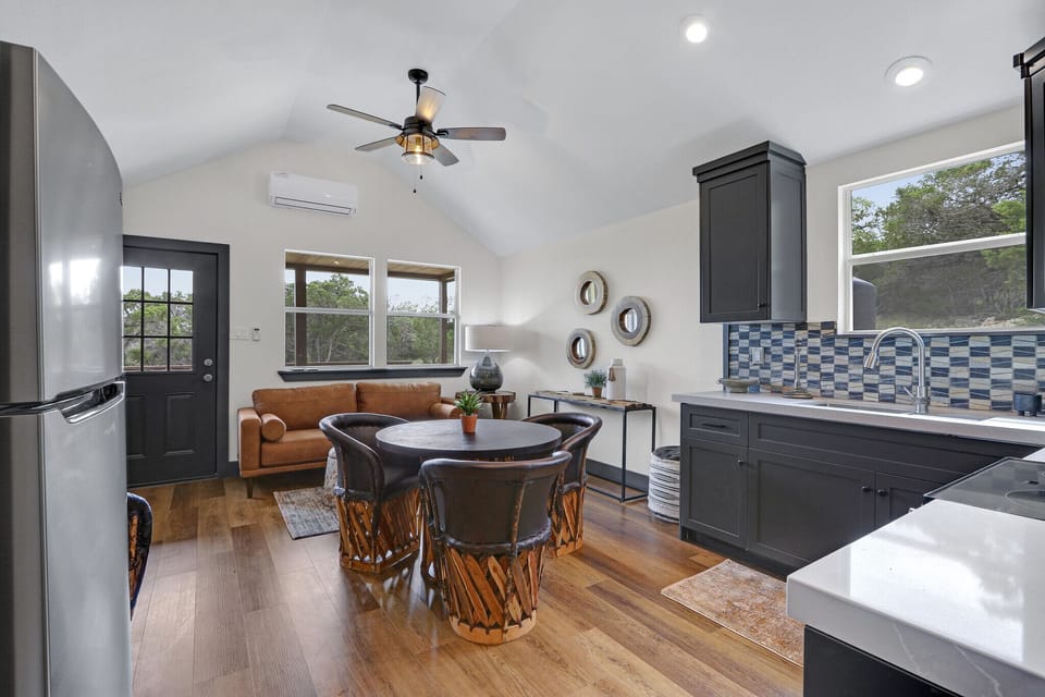 Open concept with kitchen, dining and living area connected.