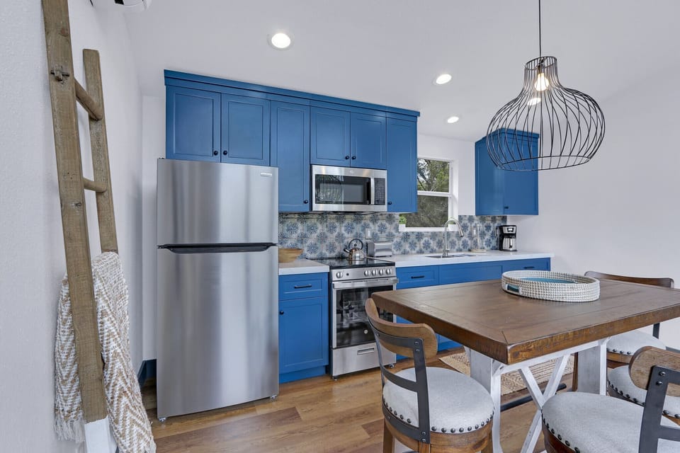 Dining table and kitchen beyond.