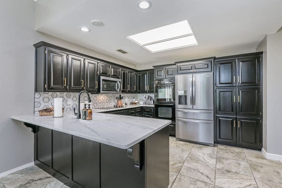 A fully stocked kitchen with double ovens all modern stainless appliances, electric cooktop, large sink and ample pantry space will let you prepare meals and snacks for the whole family.
