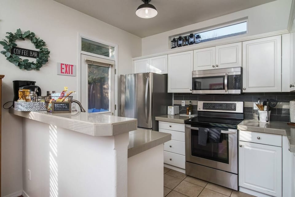 Fully equipped kitchen with stainless appliances and all the cookware and serving items you need. This is my actual home, so I haven't skimped on the kitchen, please make all the meals you can possibly enjoy. If you want to eat out, I have ideas too!