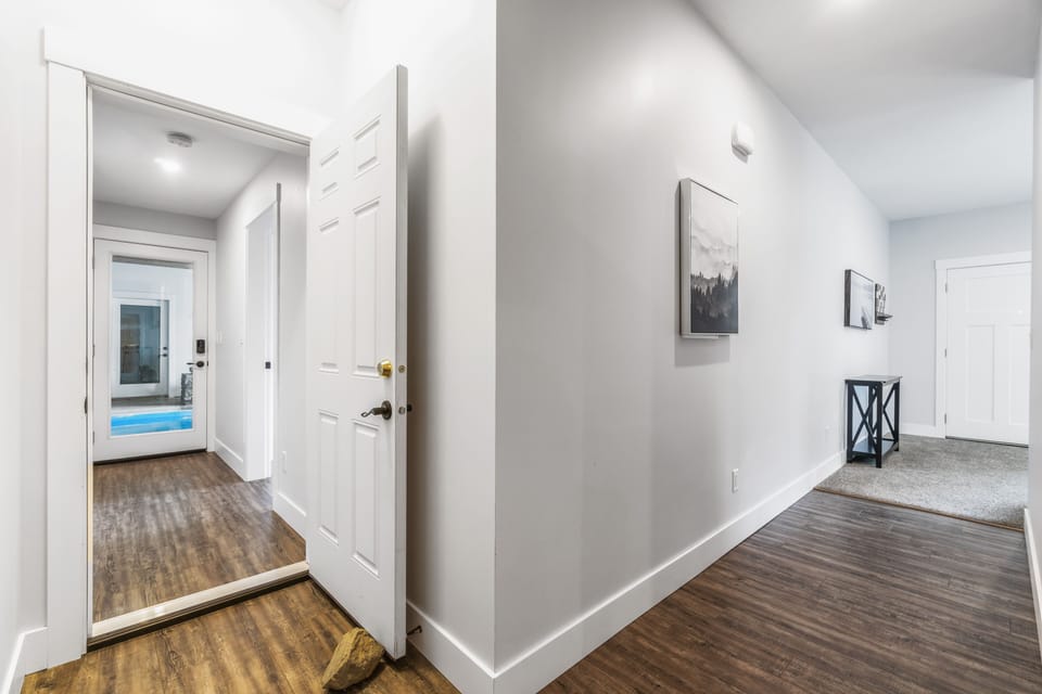 Hallway facing pool and living room