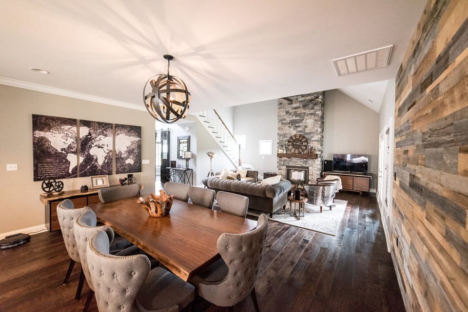 Living and Dining room with gas fireplace and smart TV with every package
