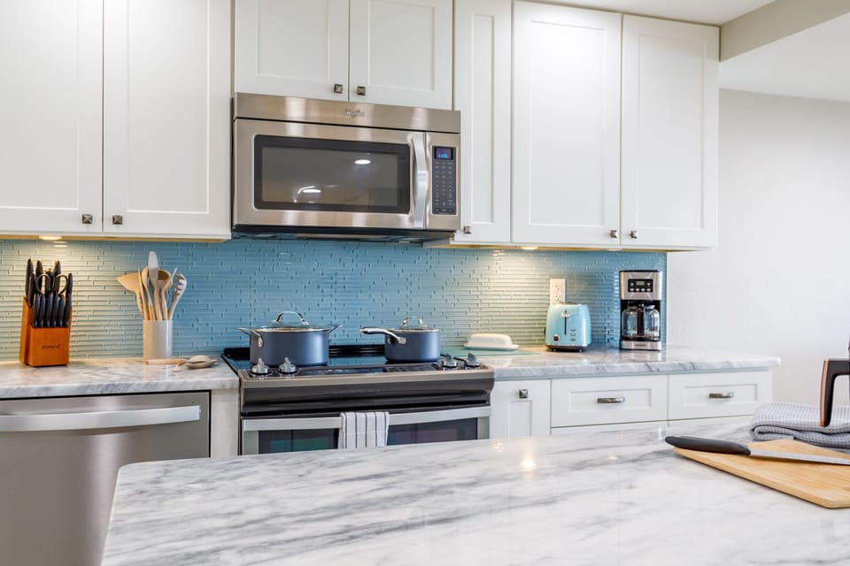 Paloma Penthouse's updated and stunning kitchen is as functional as it is visually appealing.  Everything is premium...even the safe you will find in the pantry.