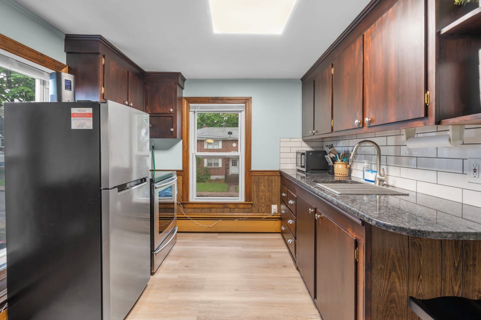 Kitchen, with a stool and overhang to eat at