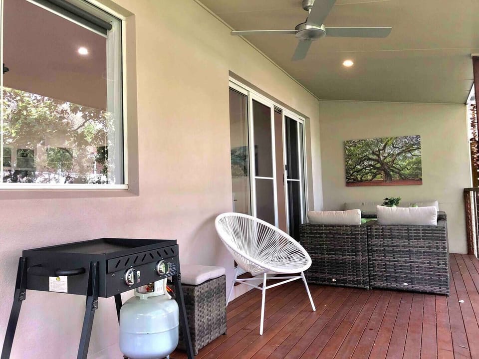 Private deck flows of open plan living space. Great place to chill out and BBQ!
