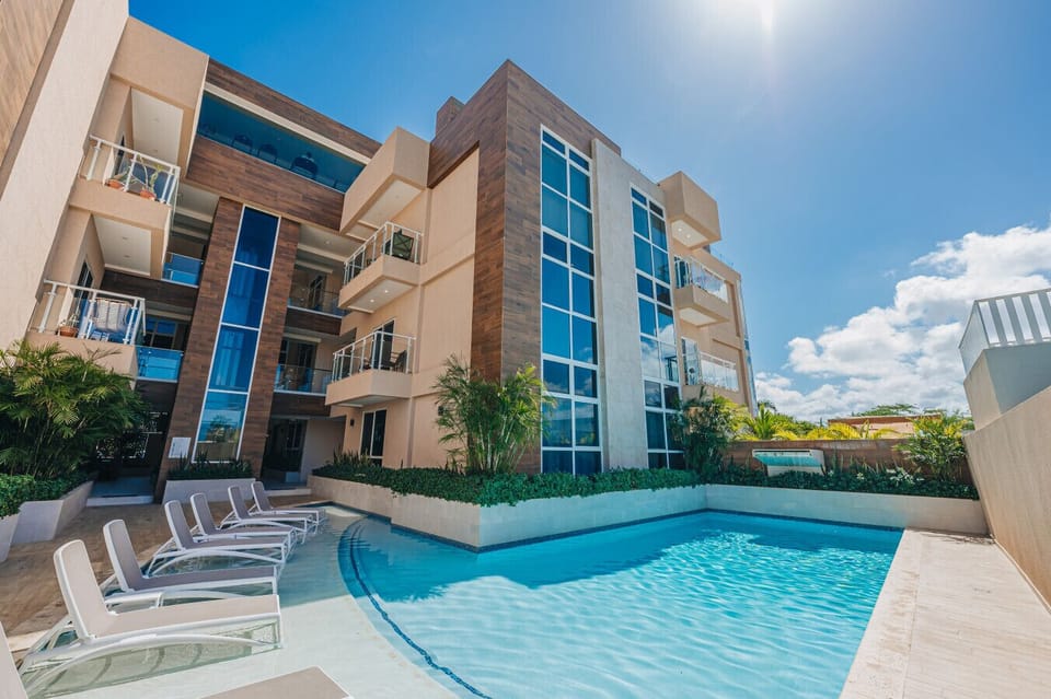 Aracari pool deck includes in-water loungers, offering a luxurious and refreshing relaxation experience.