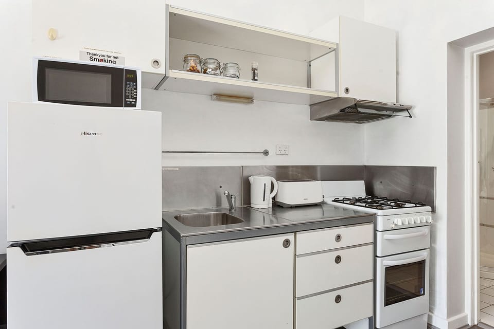 This bright and airy kitchen is perfect for cooking and entertaining. The open layout creates a sense of spaciousness and connection.
