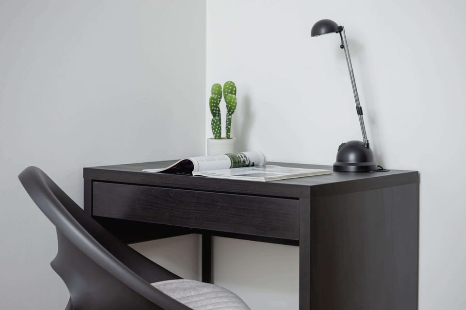 The bedroom's stylish furnishings create a serene retreat. 