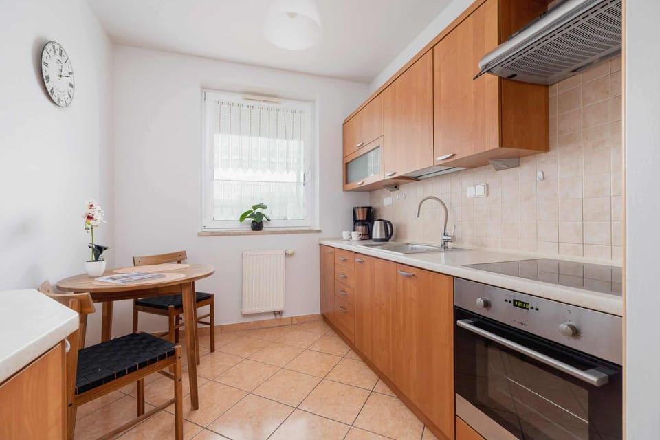 The kitchen's modern amenities ensure a comfortable stay. 