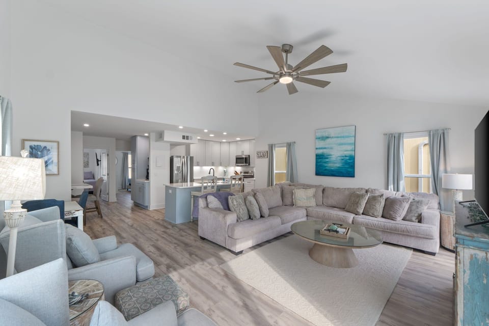 Step into your spacious open-concept living area where plush seating and modern design create the perfect retreat for relaxation and gathering.