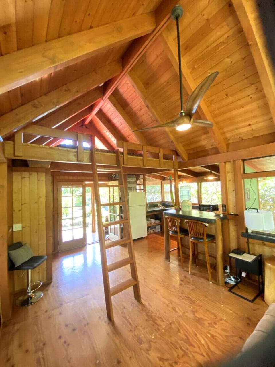 Sleeping loft with King Bed sits above the foyer