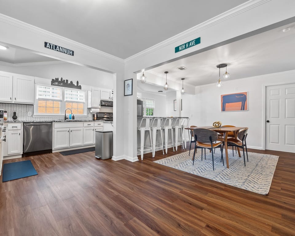 Dining Area - Breakfast Bar Seating (5), Dining Table (8) more chairs in hall