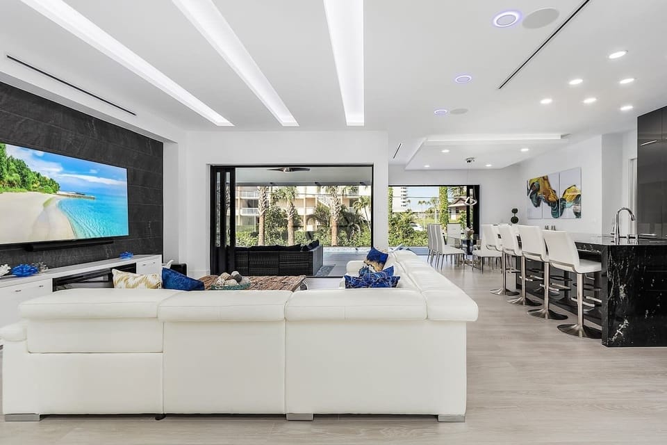 Living room facing patio doors to pool/lanai area