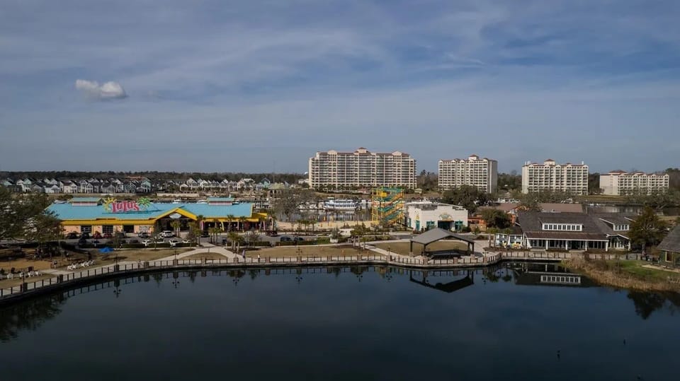 Tranquil waterfront marina with boats and golden reflections