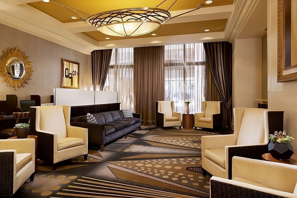 Unwind in the elegant lounge with plush seating and warm light.