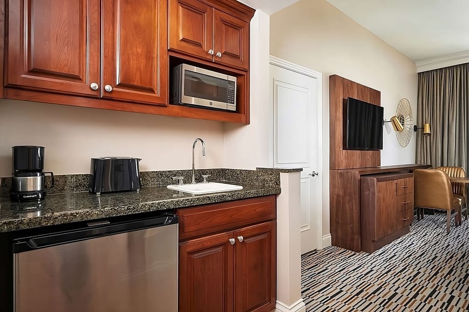 Prepare snacks easily with handy kitchenette and mini fridge.