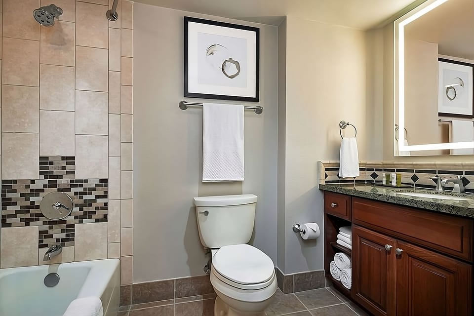 Rinse off comfortably with tiled tub-shower and ample towels.