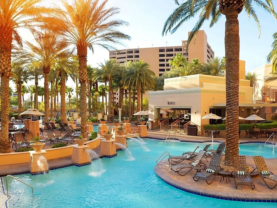 Dive into sunlit palms and sparkling lagoon-style pool days.
