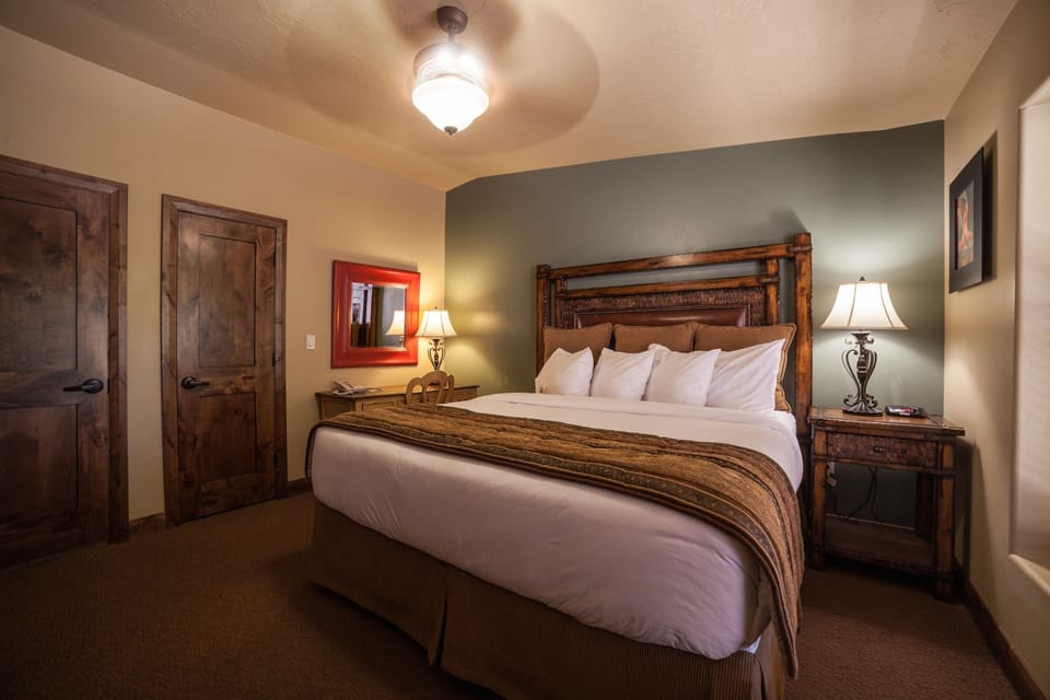 Sink into a cozy king bed with rustic charm.