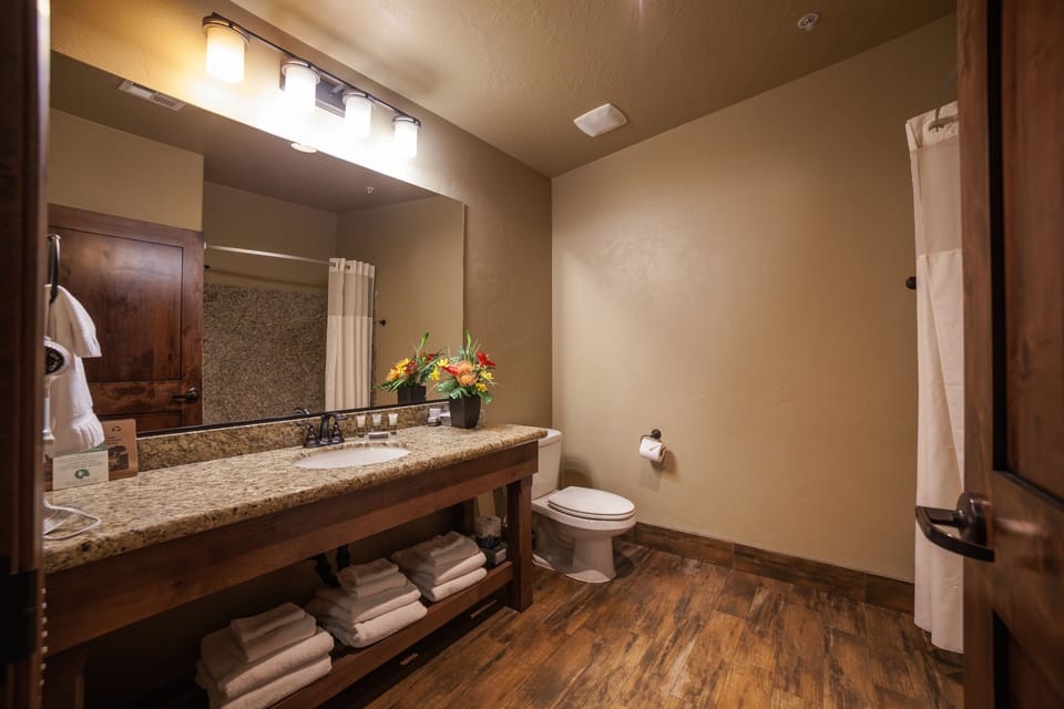 Refresh with a spacious vanity and neatly stocked, fluffy towels.