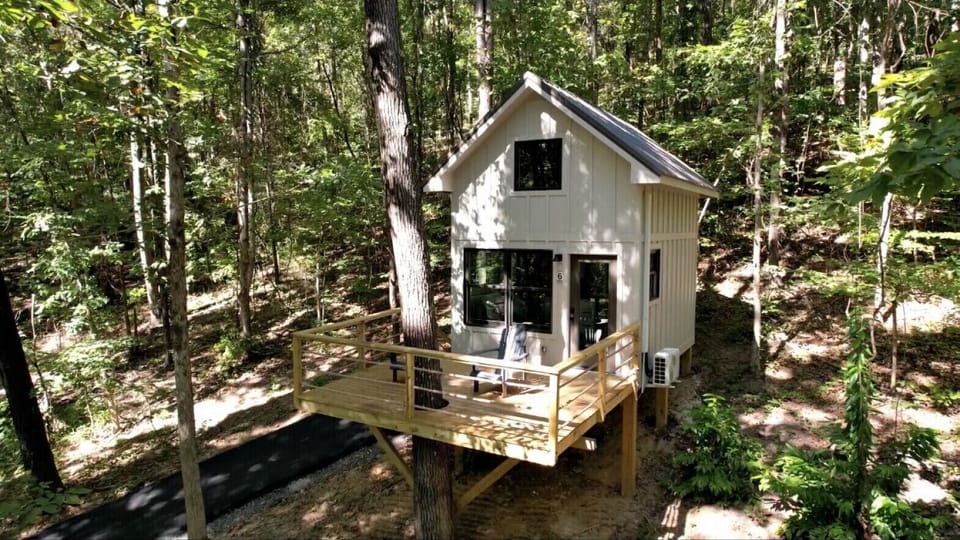 Luxury treehouse with forest views, perfect for a romantic getaway or adventure in nature. Includes a private deck and access to hiking trails.