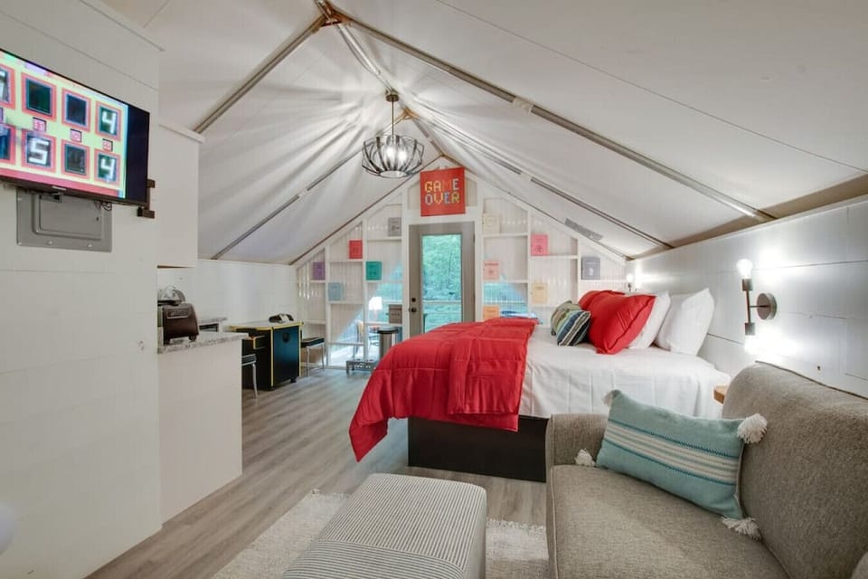 Spacious glamping tent featuring a private hot tub, king bed, and scenic views. Experience luxury camping in the heart of North Alabama.