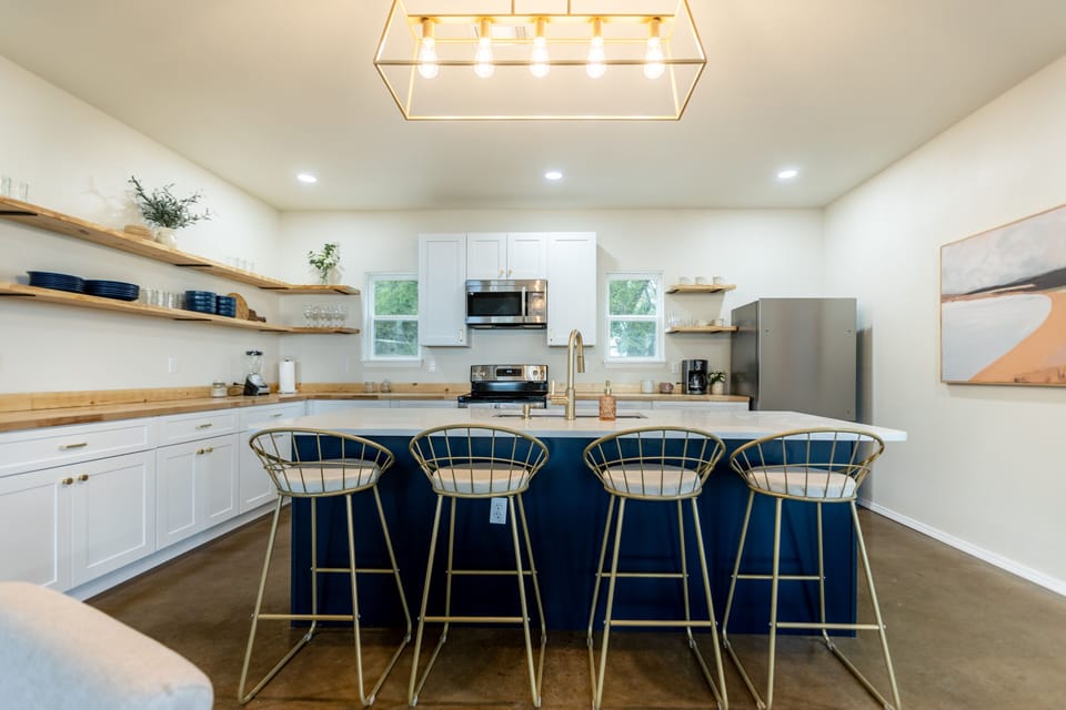 Fully Kitchen and Island. We’ve got all the dish-wear and utensils for you!