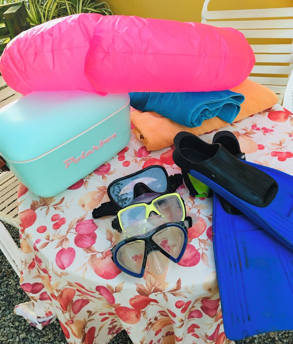 Snorkel equipment, beach towels, and an ice jug are provided for your beach day.