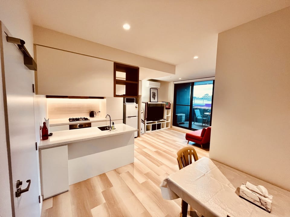 Kitchen, living room and balcony.