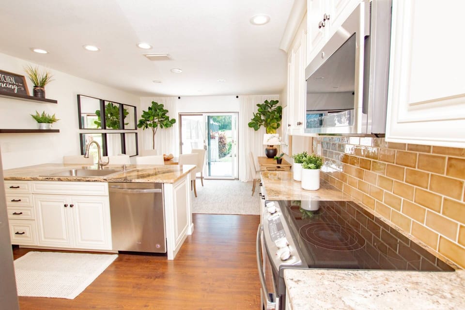 Kitchen area with microwave, coffee maker, dishwasher, stove and oven & wine refrigerator!