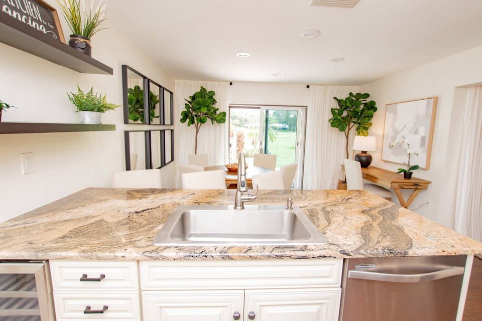 The kitchen is perfect for interacting with guests at the bar, table or desk!