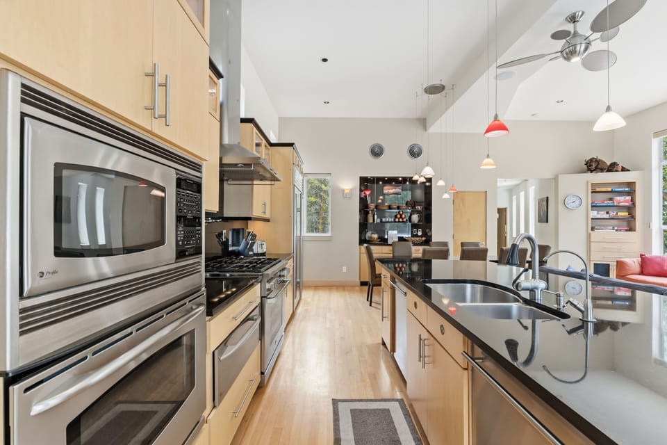 Your spacious gourmet kitchen awaits, featuring stainless steel appliances, dual sinks, and plenty of counter space for preparing memorable meals during your stay.