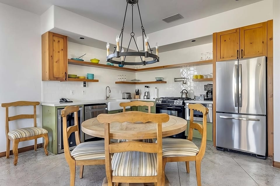 Cook and connect in the airy kitchen with rustic dining.