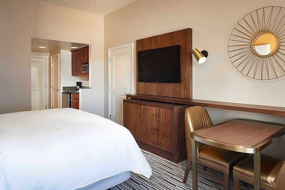 Kick back with in-room dining and TV for easy nights.