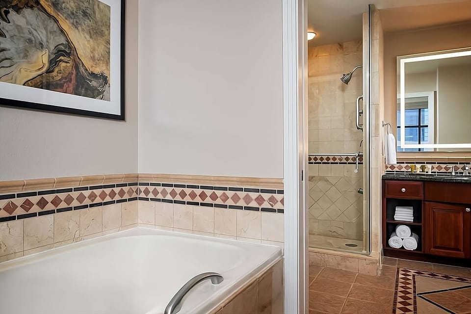 Savor extra space with a spa alcove and sleek shower.