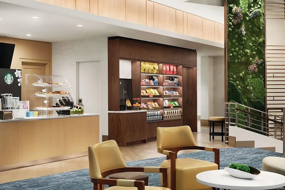 Unwind in the stylish lobby with café treats and seating.