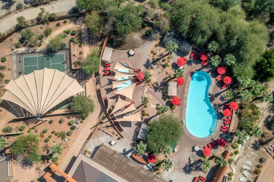 Get the full poolscape view—shade sails, loungers, and sunshine.