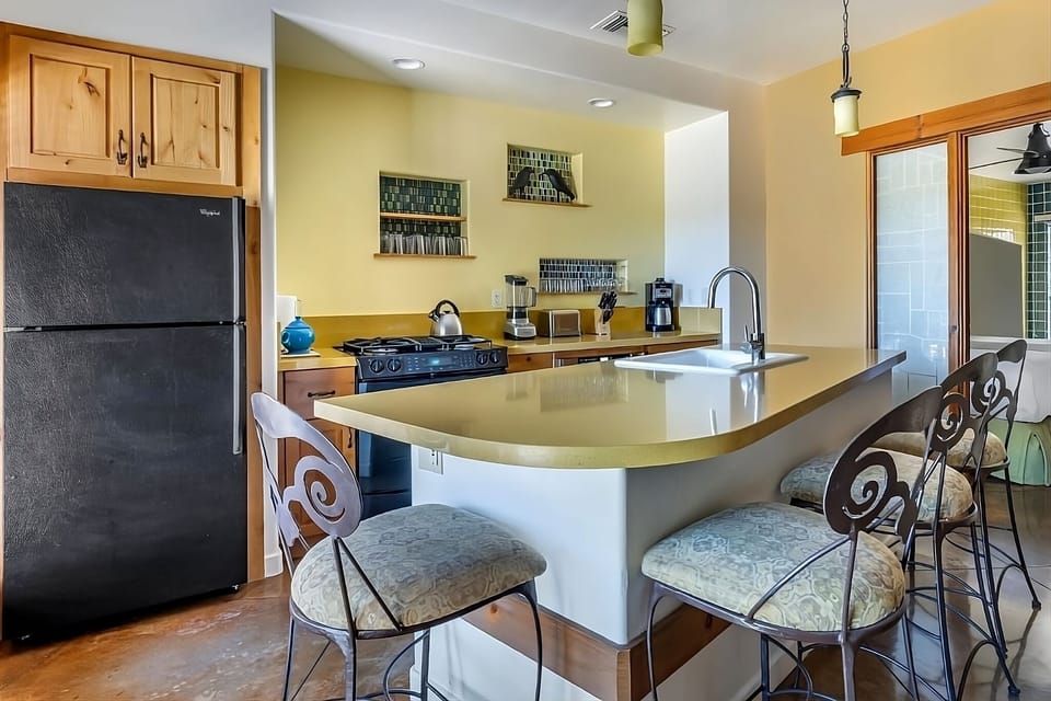 Cook with ease at the spacious breakfast bar and stove.