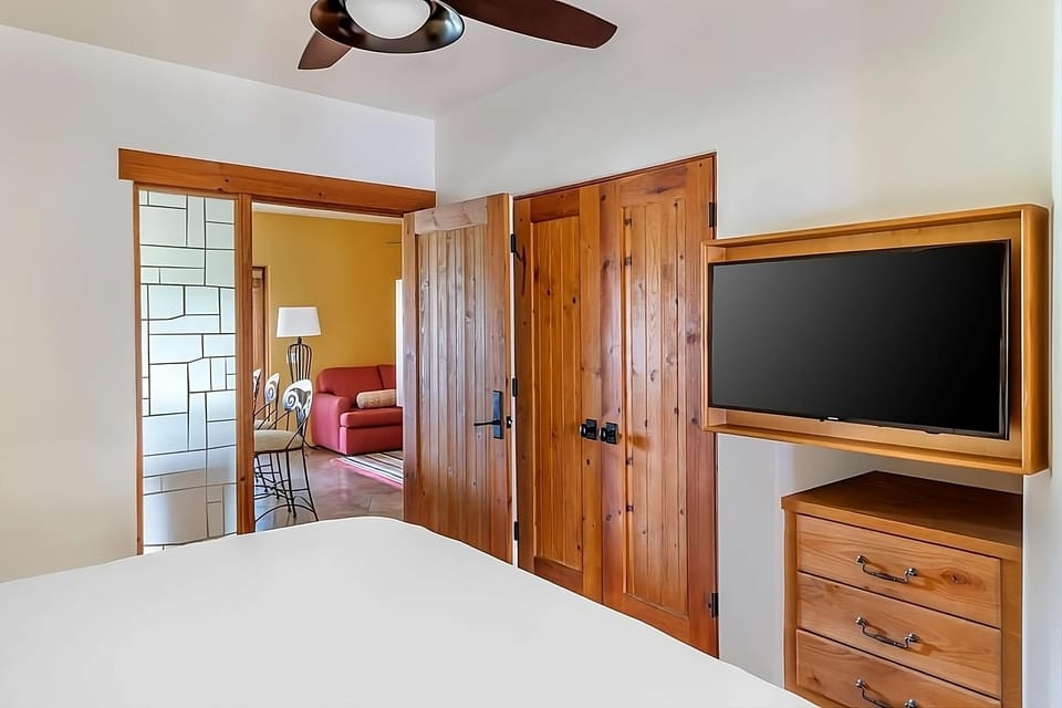 Settle in with in-room TV and warm wood accents.