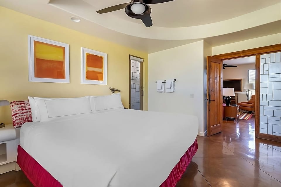 Stretch out in a spacious bedroom with polished floors and comfort.