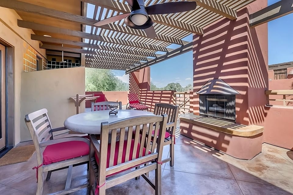 Sip morning coffee on the shaded terrace by the fireplace.