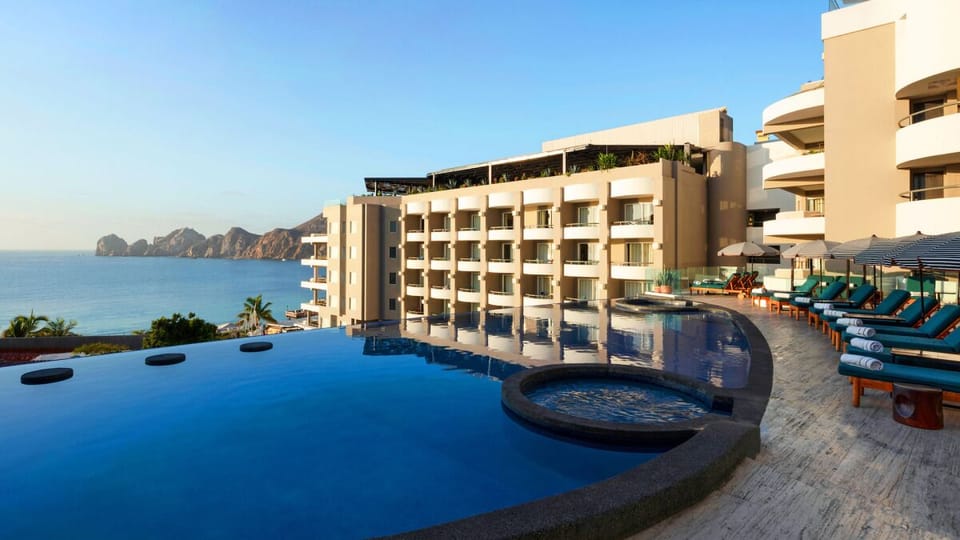 Bask in resort elegance with sweeping pools and ocean backdrop