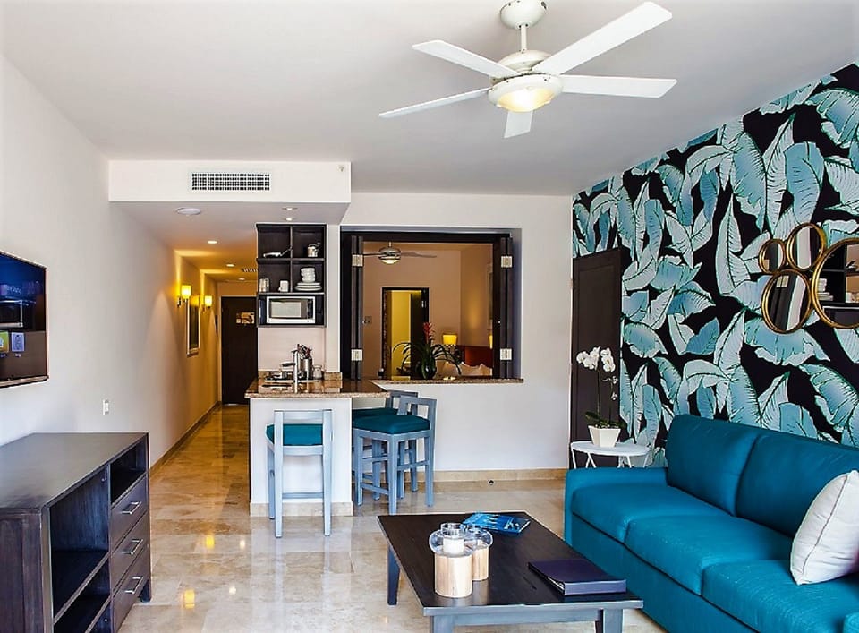 Gather for drinks at the bar beside the stylish lounge.