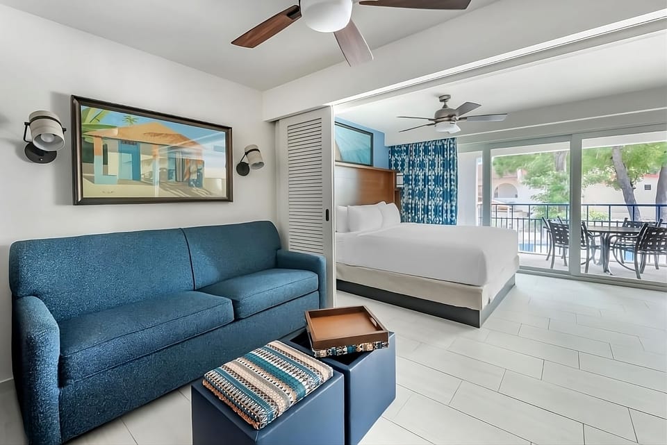 Kick back on the comfy sofa steps from the balcony.